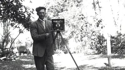 A man with one of the very first cameras