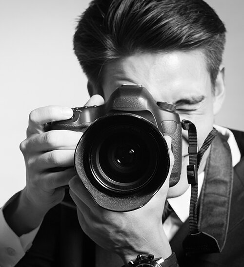 A man with a digital camera